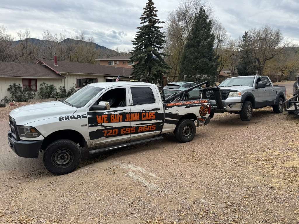 Bahuinos tow truck hauling a vehicle in the Colorado mountains